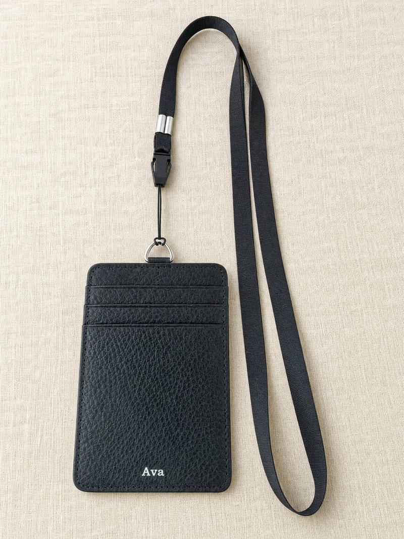 Personalised leather lanyard in black, the name Ava pressed in silver foil